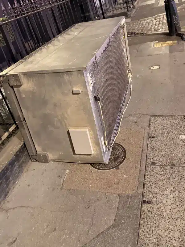 Can I Take My Old Fridge to the Tip? A London Guide 1 American-style fridge wrapped and left on the pavement in Fitzrovia, ready for our morning collection