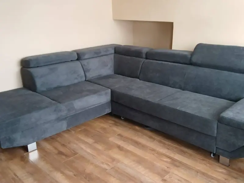 Rubbish Collection in Greenwich 1 Grey L-shaped corner sofa in a living room, ready for collection