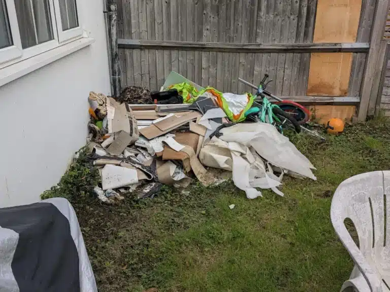 Rubbish Collection in Croydon 2 Old wood, plastic and garden rubbish waiting for collection in a South Croydon back garden